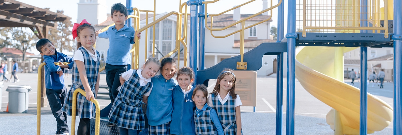 students smiling on playground
